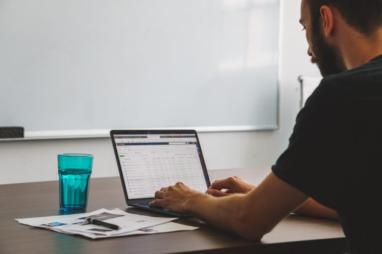 Man looking at facebook ads dashboard